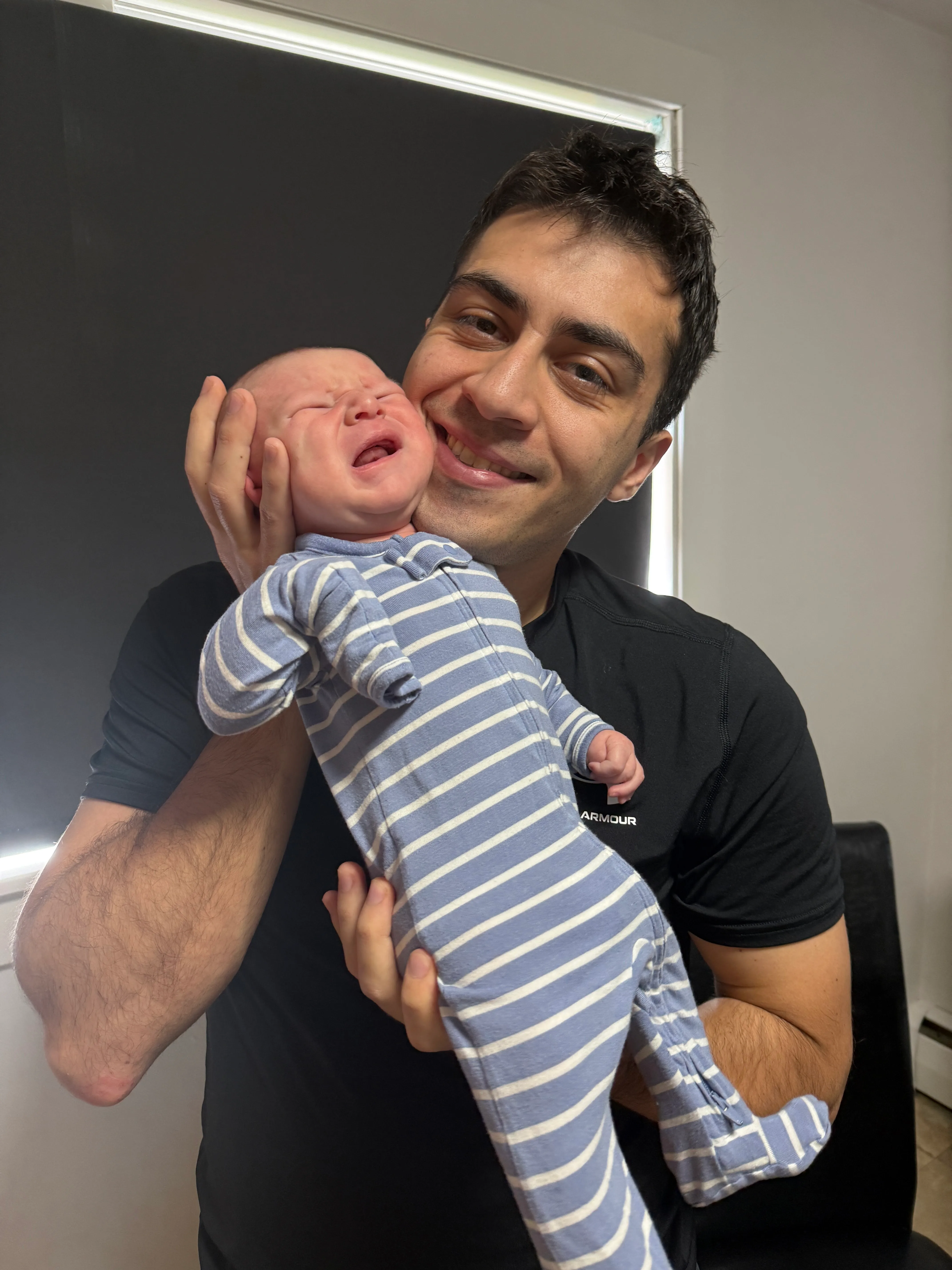 Mark with crying baby Nolan