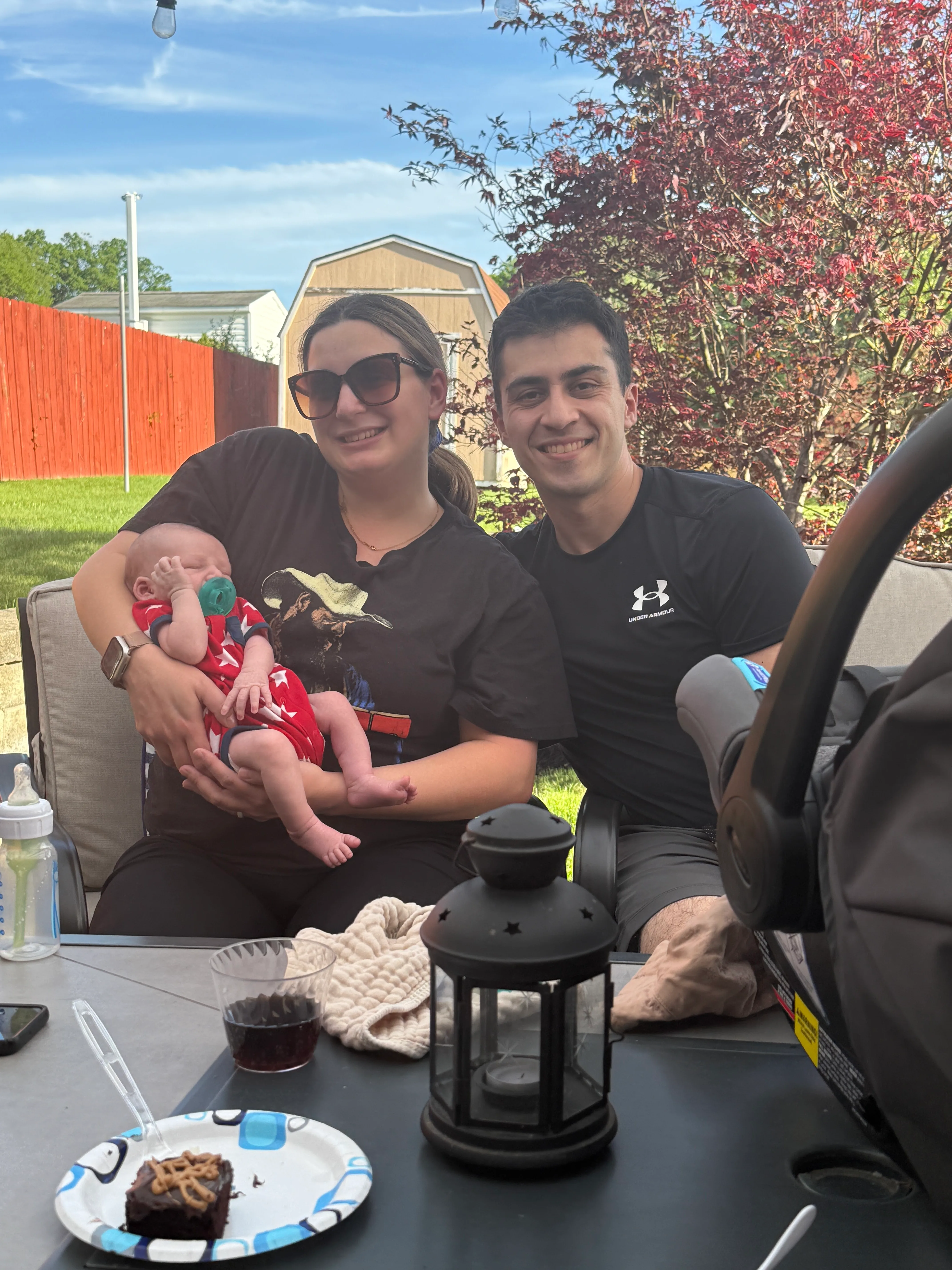Mark, Amanda, and Nolan together on the back patio